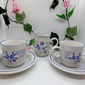 Teacups with Saucers and Creamer.